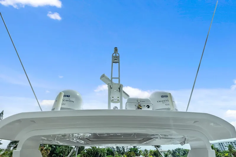 Class Dismissed Yacht Photos Pics Azimut 72 Flybridge 2017 yacht radar and antennas against blue sky.