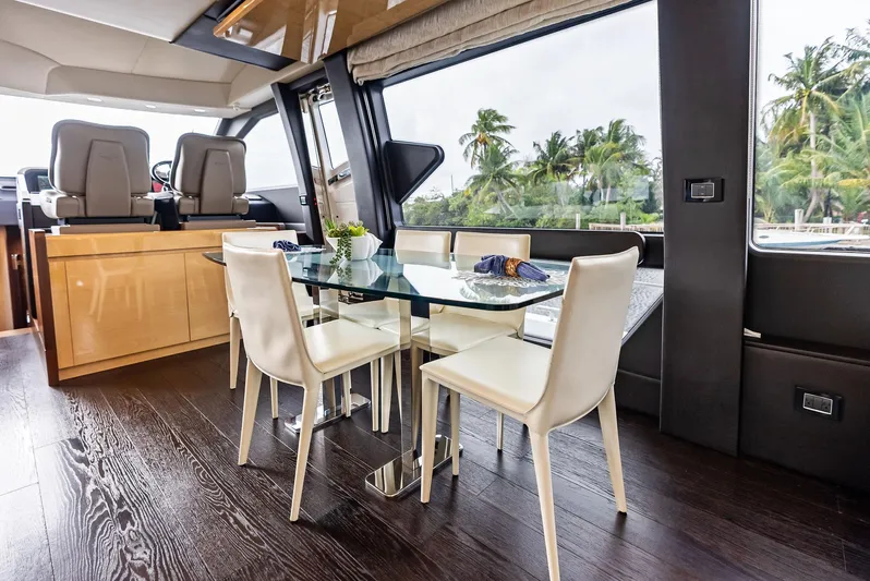 Class Dismissed Yacht Photos Pics Luxurious interior of 2017 Azimut 72 Flybridge yacht with elegant dining area.