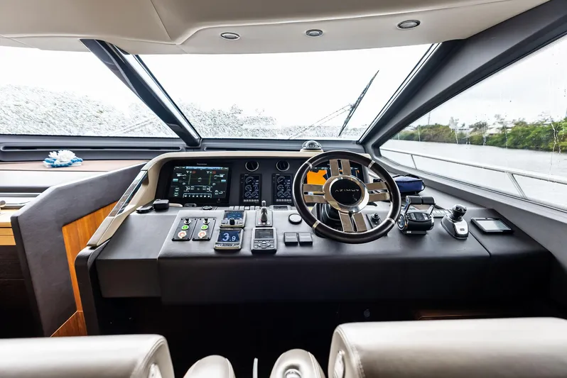 Class Dismissed Yacht Photos Pics Cockpit of 2017 Azimut 72 Flybridge yacht with modern controls and steering wheel.