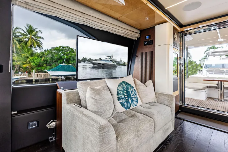 Class Dismissed Yacht Photos Pics Luxurious interior of 2017 Azimut 72 Flybridge yacht with plush seating and scenic view.