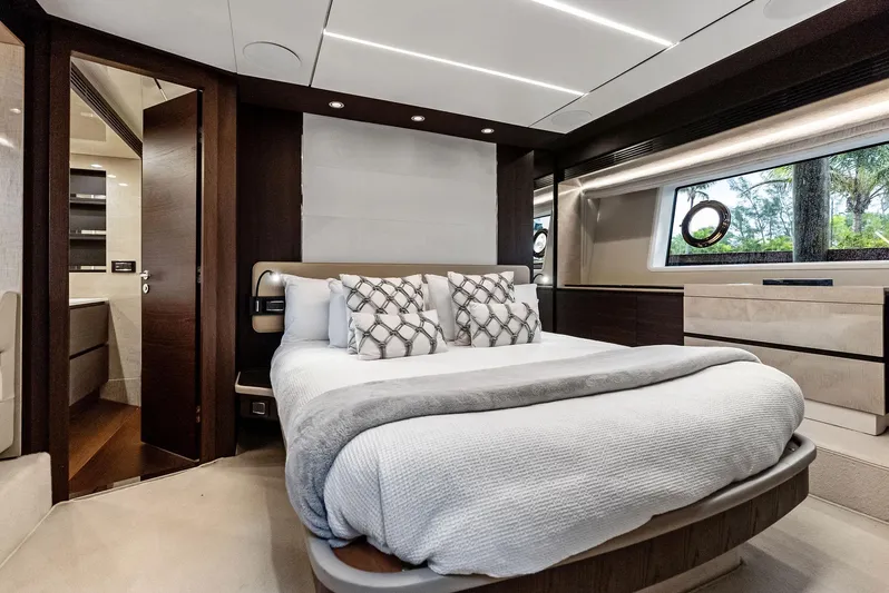 Class Dismissed Yacht Photos Pics Luxurious bedroom interior of 2017 Azimut 72 Flybridge yacht with modern design and elegant furnishings.