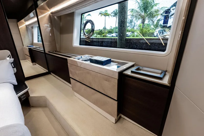 Class Dismissed Yacht Photos Pics Luxurious interior of 2017 Azimut 72 Flybridge yacht with elegant furnishings and large window.