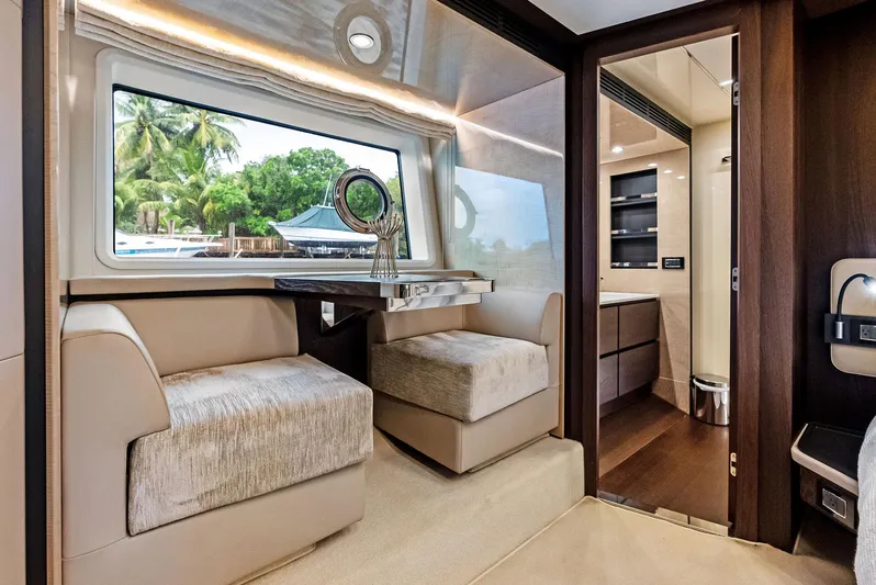 Class Dismissed Yacht Photos Pics Luxurious interior of 2017 Azimut 72 Flybridge yacht with elegant seating and scenic window view.
