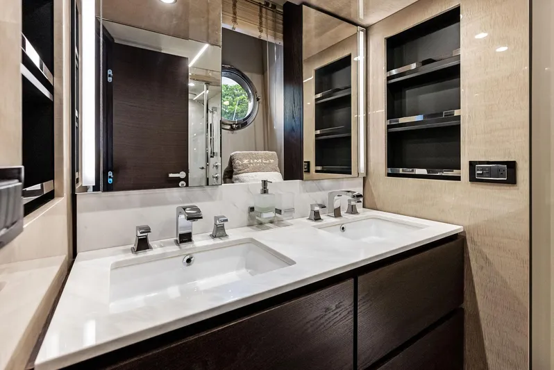 Class Dismissed Yacht Photos Pics Luxurious bathroom in 2017 Azimut 72 Flybridge yacht with dual sinks and modern fixtures.