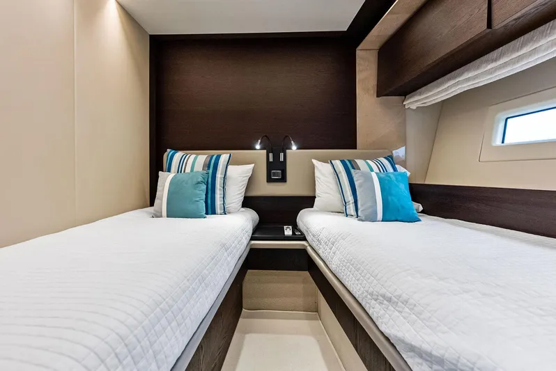 Class Dismissed Yacht Photos Pics Twin cabin interior of 2017 Azimut 72 Flybridge yacht with modern decor.