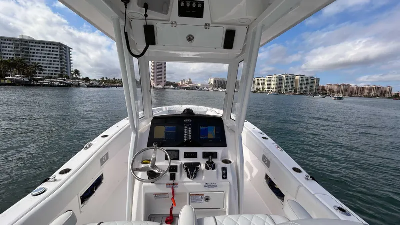  Yacht Photos Pics 2024 Sea Fox 268 Commander boat dashboard with city skyline in the background.