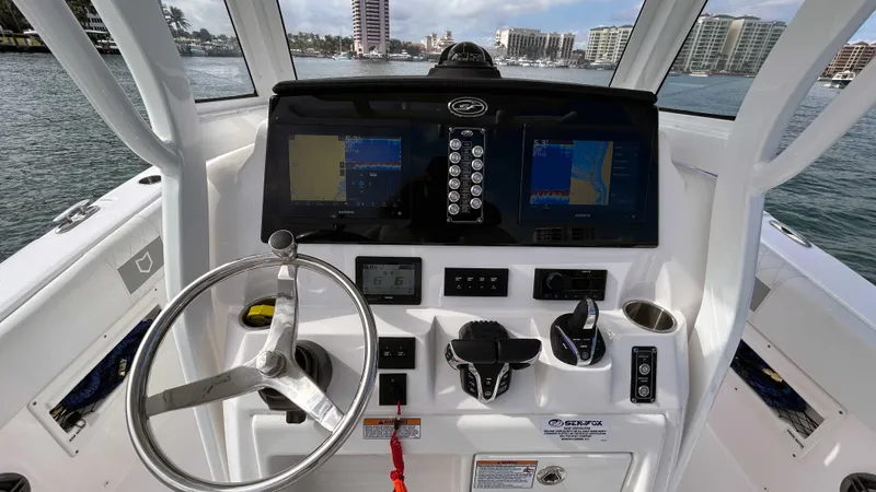  Yacht Photos Pics 2024 Sea Fox 268 Commander boat dashboard with navigation screens and controls.