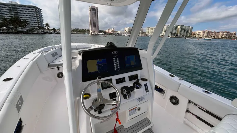  Yacht Photos Pics 2024 Sea Fox 268 Commander boat dashboard with city skyline in the background.
