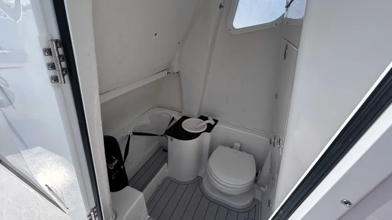  Yacht Photos Pics 2024 Sea Fox 268 Commander boat interior bathroom with toilet and sink.