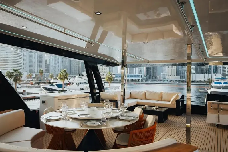 Mazarin Evo II - E-motion Italy - Parallel Hybrid Yacht Photos Pics Luxurious interior of 2025 Mazarin 55 EVO II yacht with marina view.