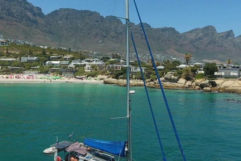 Gabsi Yacht Photos Pics Sailboat "Southwell 51" near scenic coastline with mountains and beach, 2022.