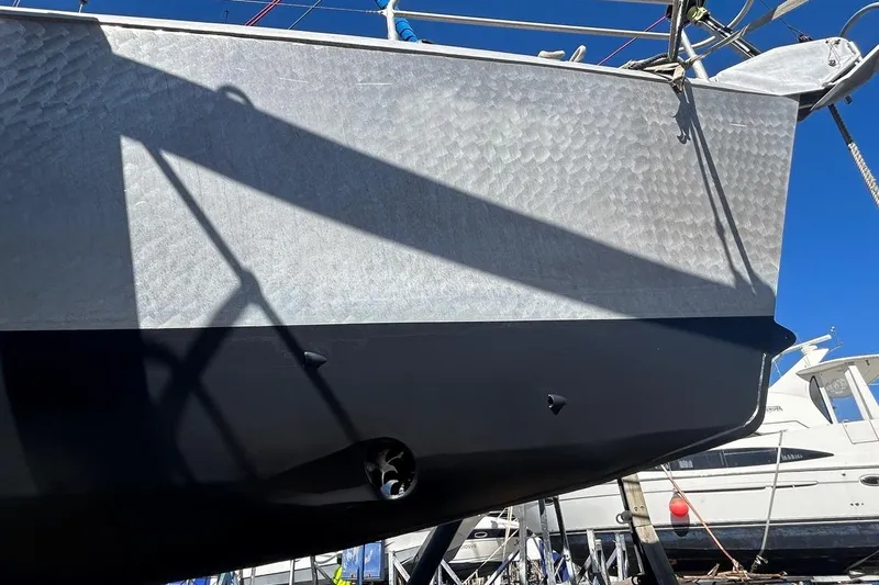 Gabsi Yacht Photos Pics Custom Southwell 51 yacht, 2022 model, with sleek metallic hull under clear blue sky.