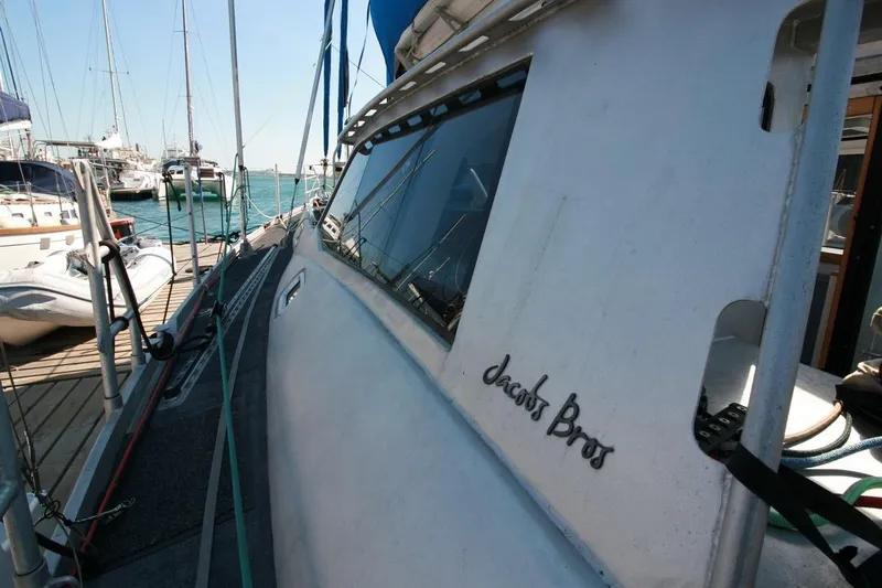 Gabsi Yacht Photos Pics Custom Southwell 51 yacht docked at marina, 2022 model, with clear blue sky.