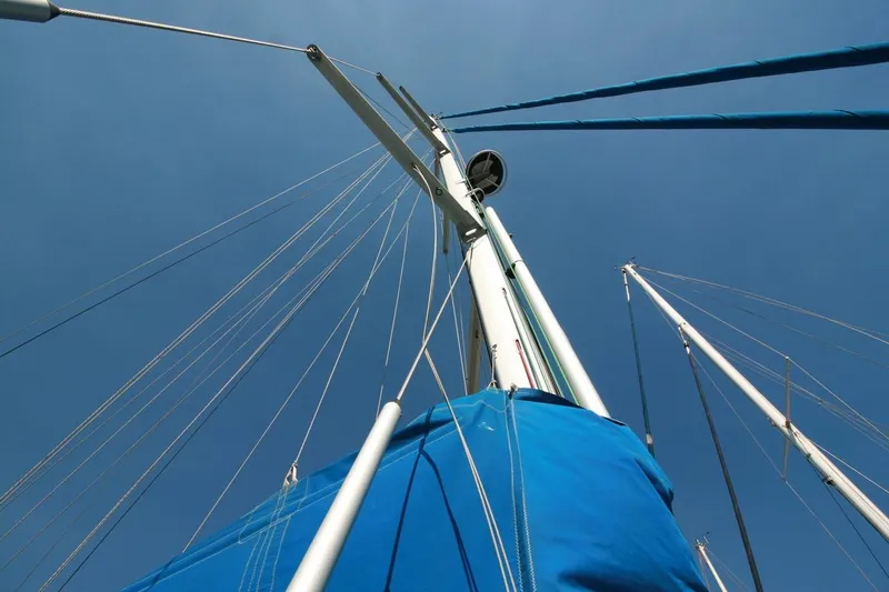 Gabsi Yacht Photos Pics Sailboat mast and rigging of 2022 Custom Southwell 51 against clear blue sky.