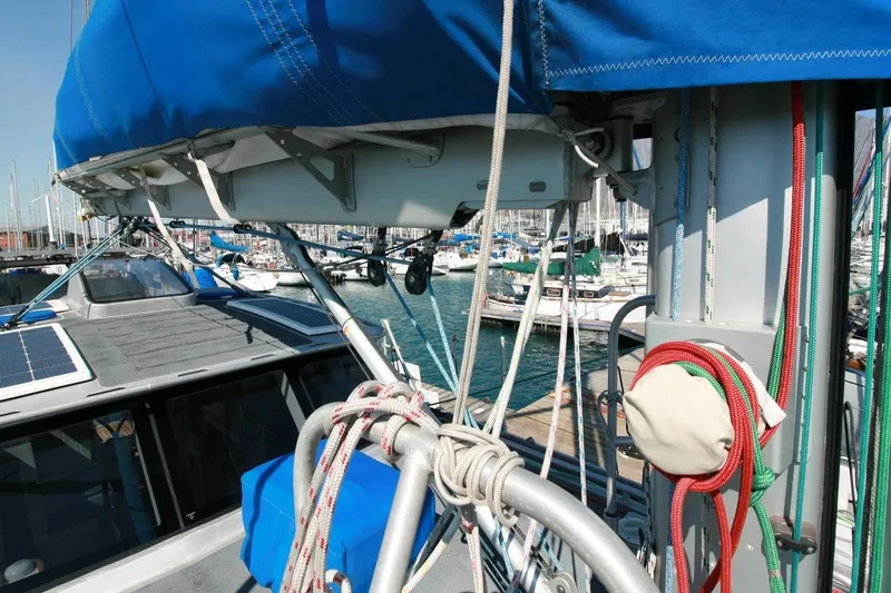 Gabsi Yacht Photos Pics Sailboat deck with ropes and blue canopy, Custom Southwell 51, 2022 model, docked at marina.