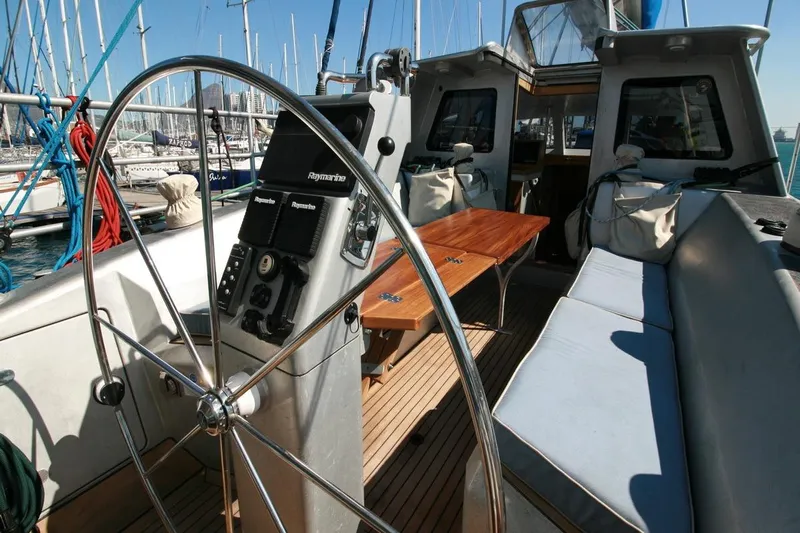Gabsi Yacht Photos Pics Luxurious 2022 Custom Southwell 51 yacht interior with steering wheel and seating area.
