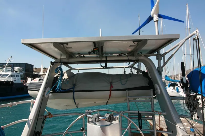 Gabsi Yacht Photos Pics Custom Southwell 51 yacht with solar panels and wind turbine, docked at marina, 2022 model.