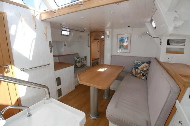 Gabsi Yacht Photos Pics Modern interior of 2022 Custom Southwell 51 yacht with cozy seating and wooden accents.