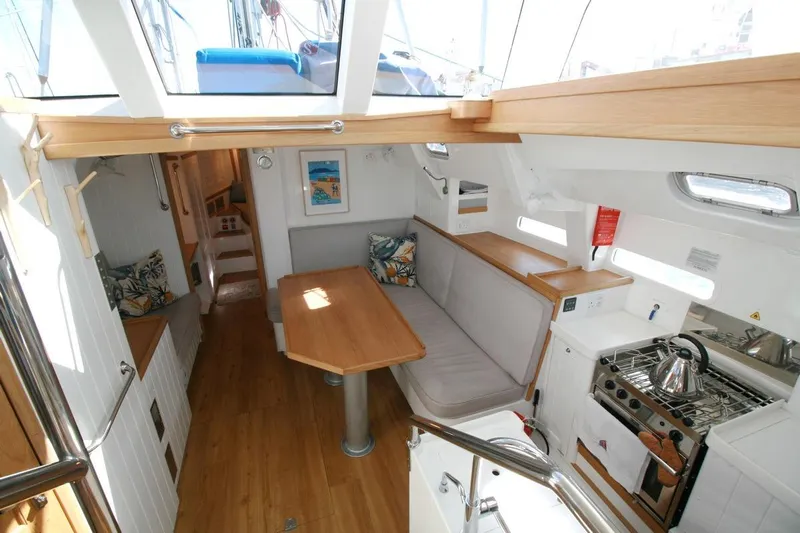 Gabsi Yacht Photos Pics Interior of 2022 Custom Southwell 51 yacht with modern kitchen and cozy seating area.