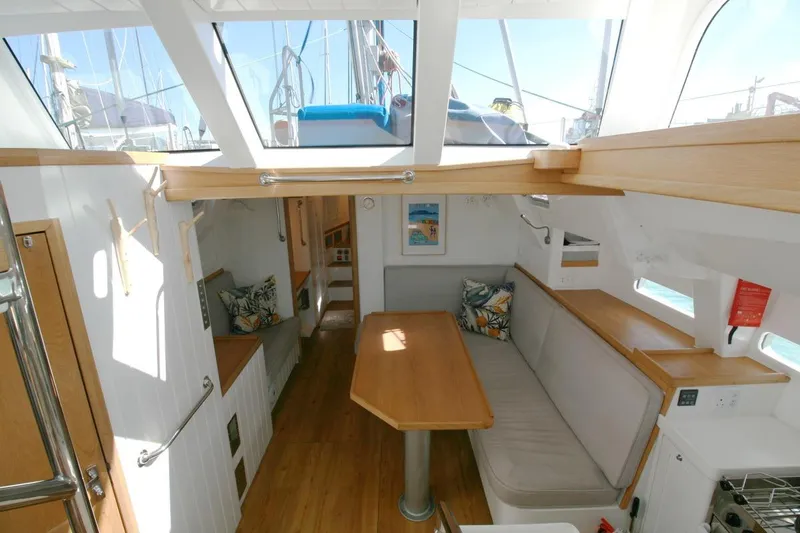 Gabsi Yacht Photos Pics Interior of 2022 Custom Southwell 51 yacht with modern seating and wooden finishes.