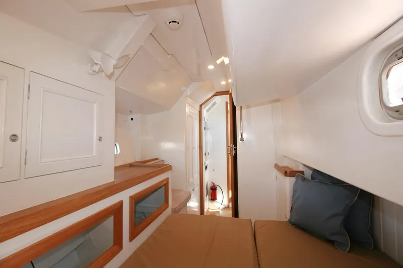 Gabsi Yacht Photos Pics Luxurious interior of 2022 Custom Southwell 51 yacht with cozy cabin and elegant wood accents.