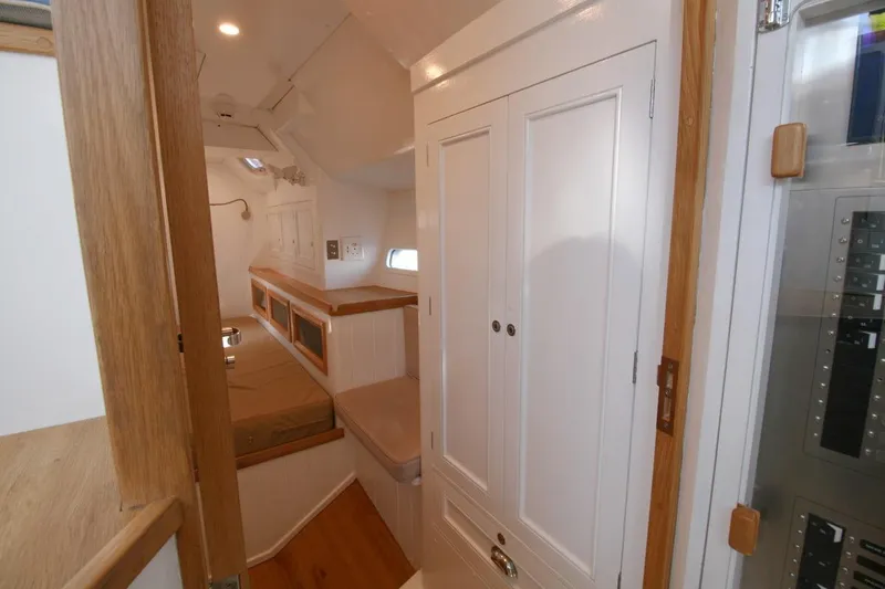 Gabsi Yacht Photos Pics Interior of 2022 Custom Southwell 51 yacht with white cabinetry and wood accents.