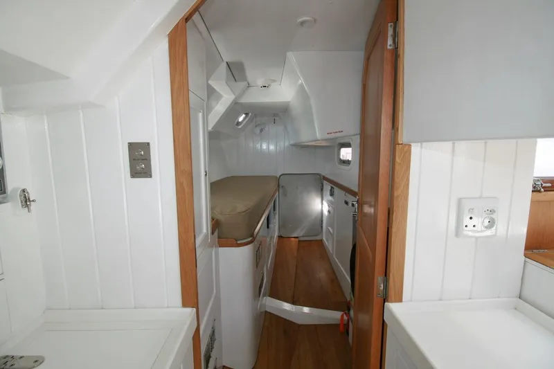 Gabsi Yacht Photos Pics Interior of 2022 Custom Southwell 51 yacht with white walls and wooden accents.