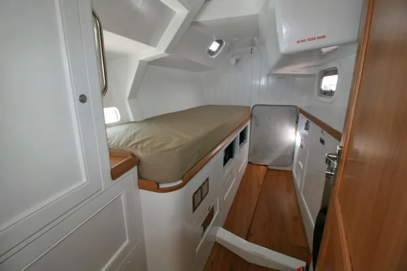 Gabsi Yacht Photos Pics Cozy cabin interior of 2022 Custom Southwell 51 yacht with wooden flooring.