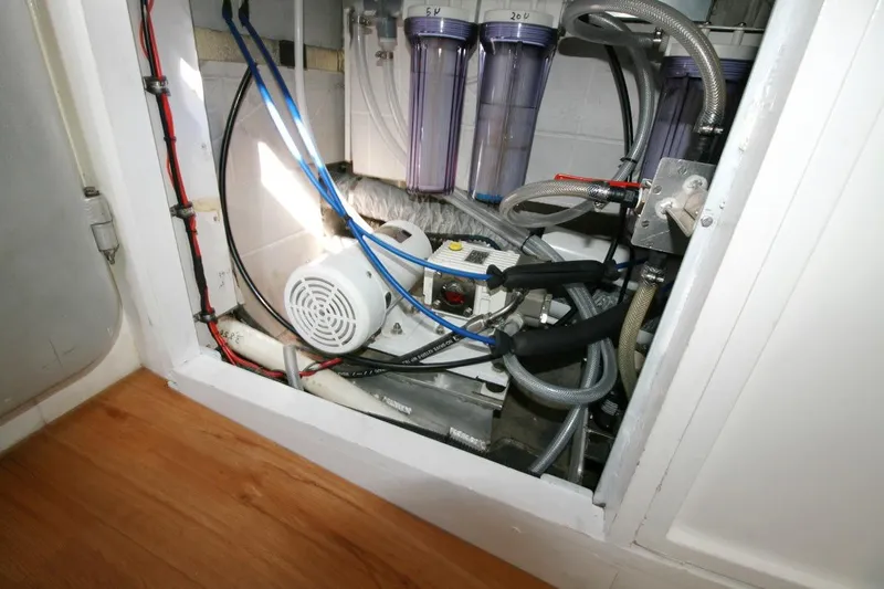 Gabsi Yacht Photos Pics Engine compartment of a 2022 Custom Southwell 51 with visible wiring and filtration system.