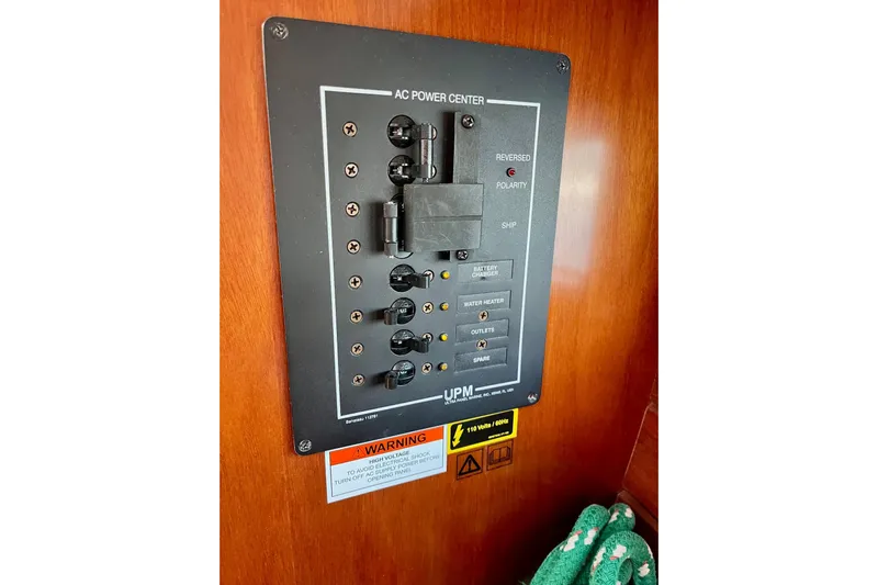 Sosy Yacht Photos Pics AC power center panel on 2006 Beneteau Oceanis Clipper 423 yacht interior.