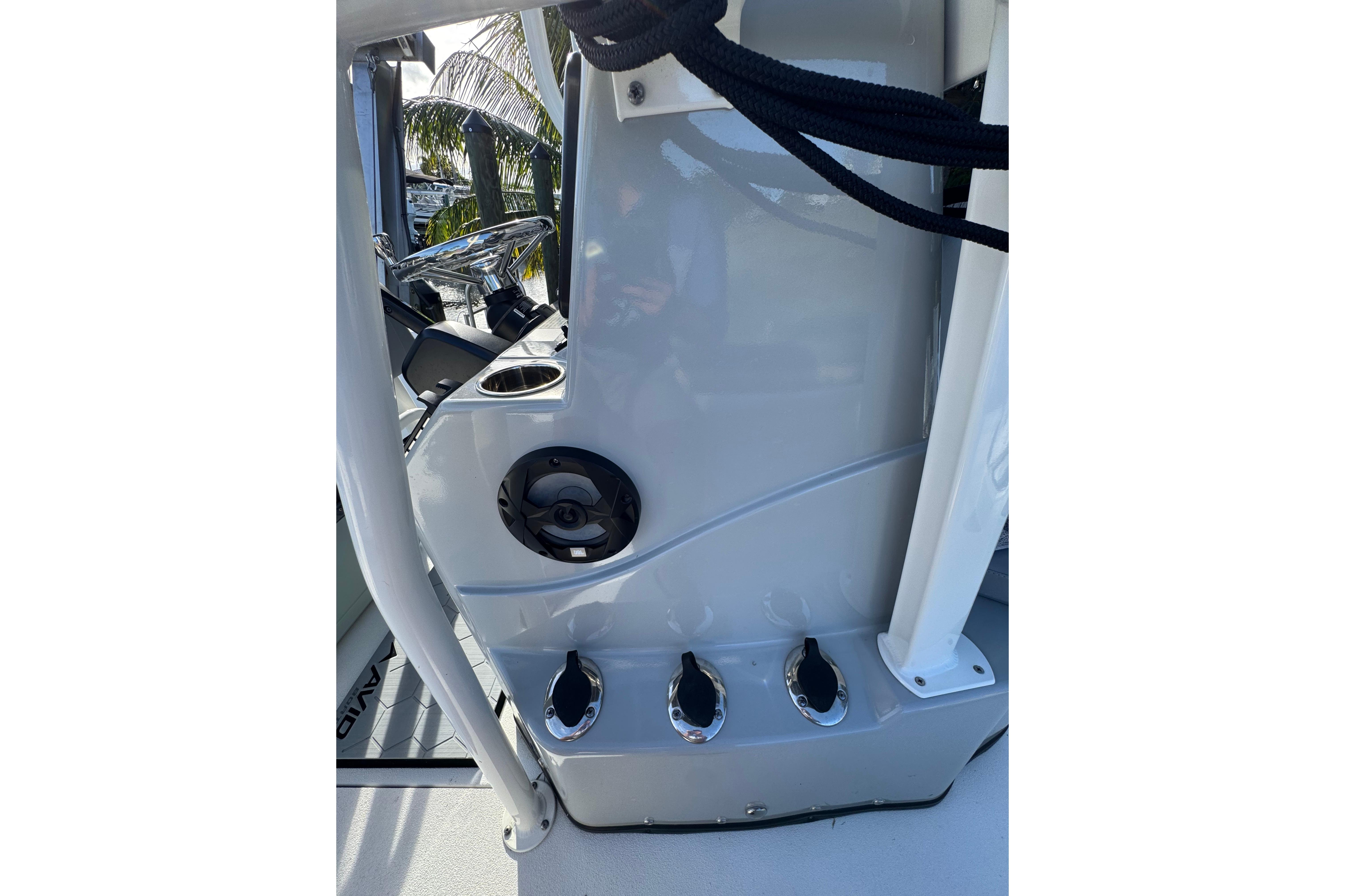 2022 Avid 23 FS Magnum boat console with steering wheel and cup holder.