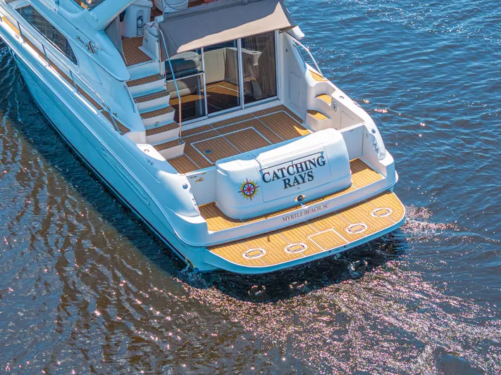  Yacht Photos Pics 1999 Sea Ray 450 Express Bridge yacht named "Catching Rays" on water, Myrtle Beach, SC.