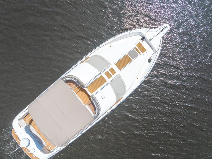  Yacht Photos Pics Overhead view of 1999 Sea Ray 450 Express Bridge yacht on water.