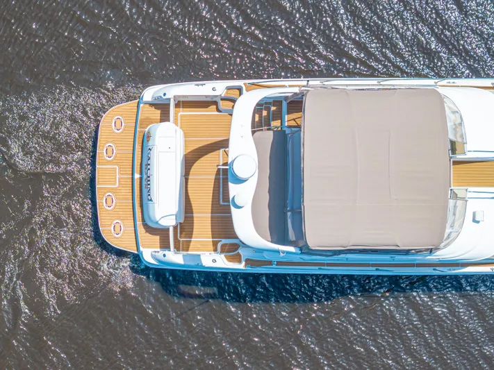  Yacht Photos Pics Overhead view of 1999 Sea Ray 450 Express Bridge yacht on water.