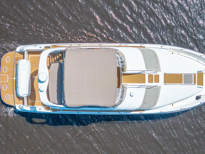  Yacht Photos Pics Overhead view of 1999 Sea Ray 450 Express Bridge yacht on water.