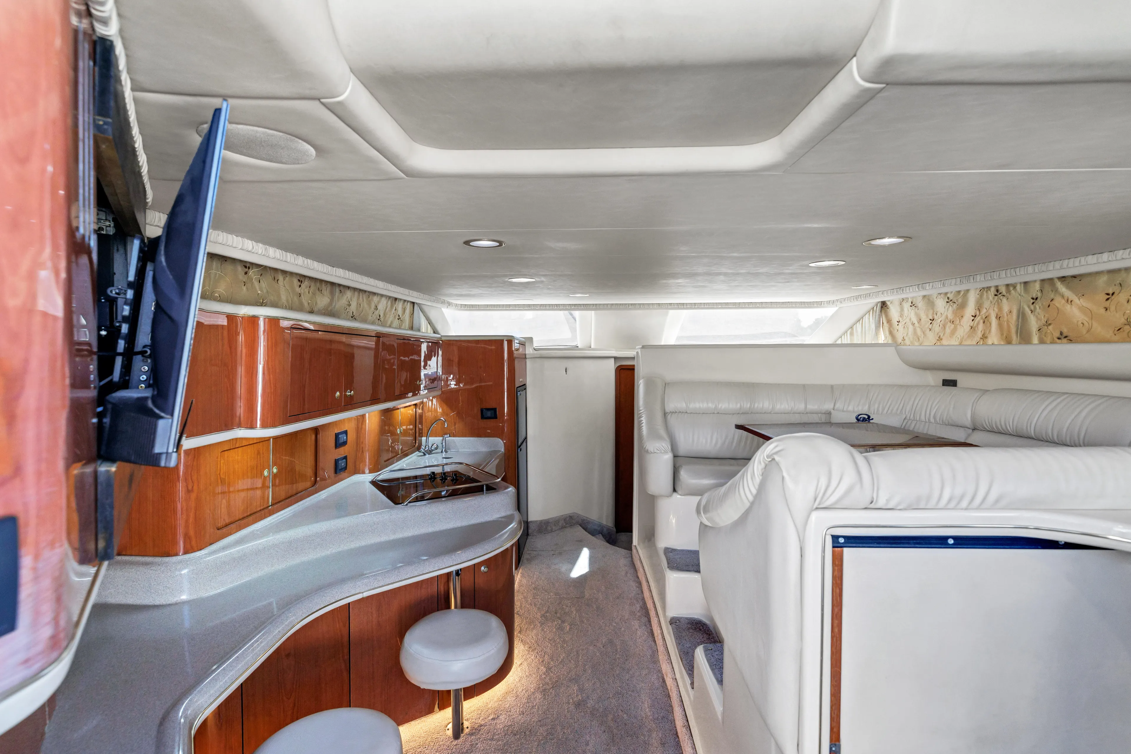  Yacht Photos Pics Interior of 1999 Sea Ray 450 Express Bridge with luxurious seating and modern amenities.