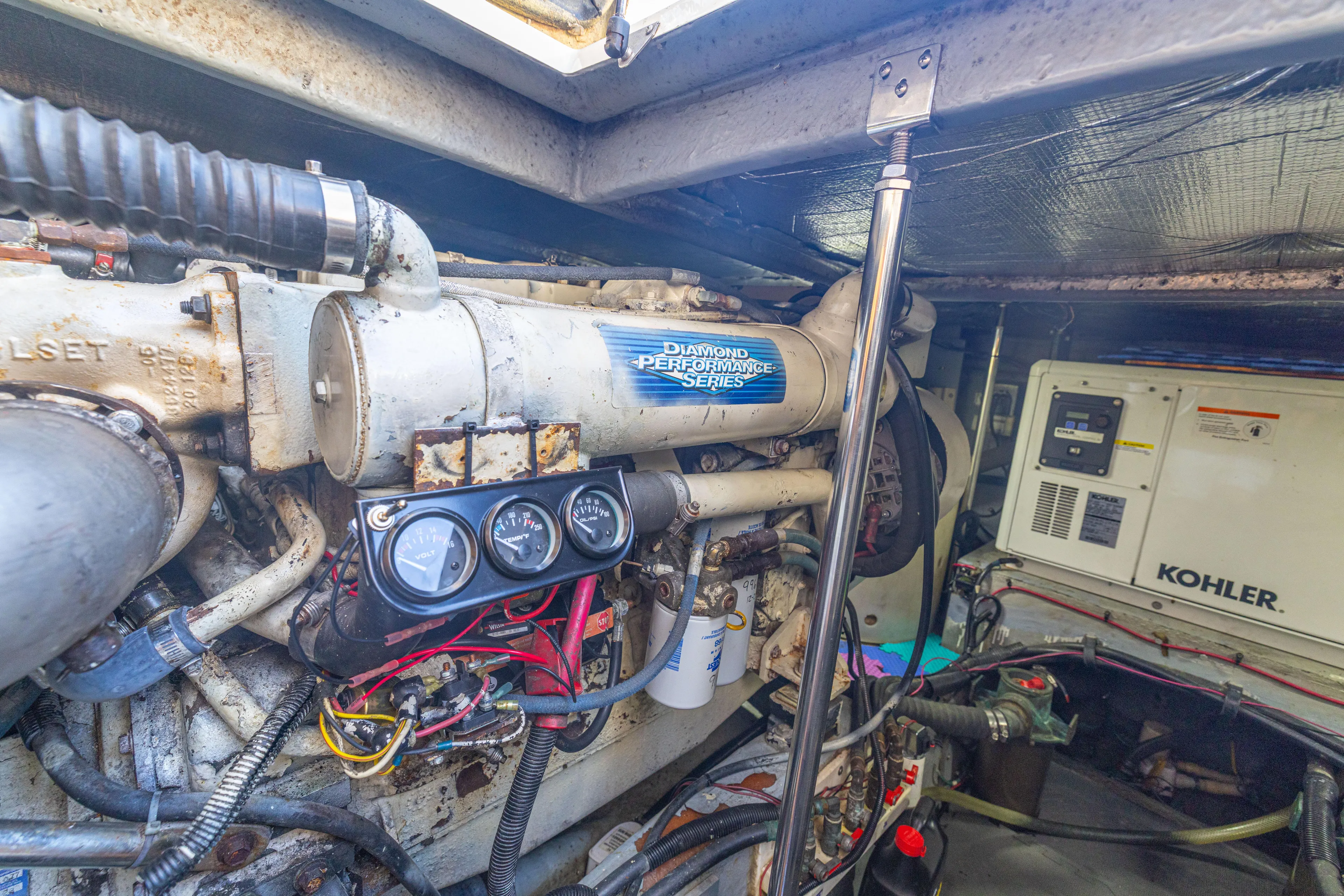  Yacht Photos Pics Engine room of 1999 Sea Ray 450 Express Bridge with Kohler generator and performance series engine.