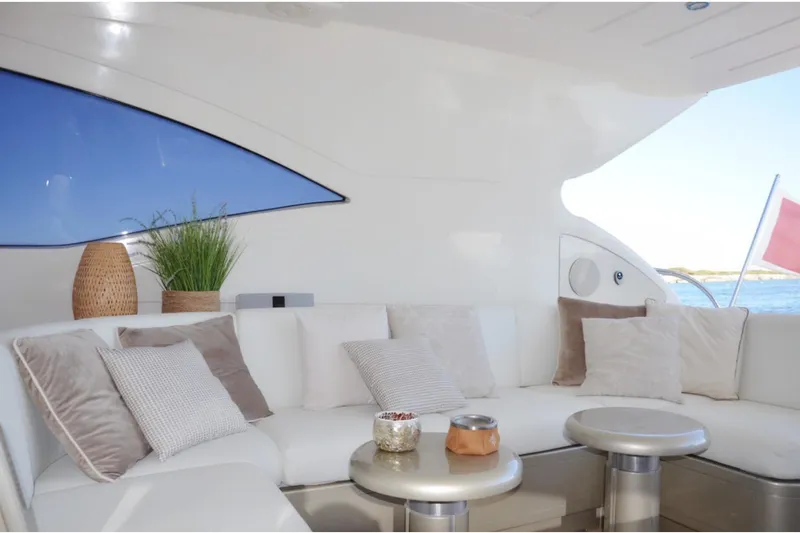  Yacht Photos Pics Luxurious interior of 2003 Mangusta 72 yacht with elegant seating and decor.