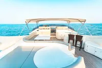 Luxurious 2007 Custom Line 112 yacht deck with seating, ocean view, and canopy.
