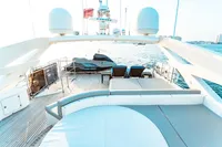 Luxurious 2007 Custom Line 112 yacht deck with sun loungers and sea view.