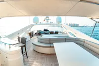 Luxurious 2007 Custom Line 112 yacht deck with seating, table, and ocean view.