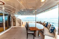 Luxurious 2007 Custom Line 112 yacht deck with elegant seating and ocean view.