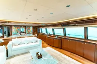 Luxurious interior of 2007 Custom Line 112 yacht with elegant furnishings and ocean view.