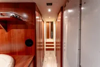 Luxurious wooden interior hallway of 2007 Custom Line 112 yacht.