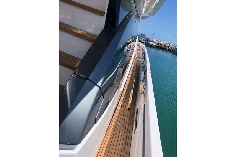  Yacht Photos Pics Sleek Azimut Fly 78 yacht deck, 2022 model, with polished wood and modern design.