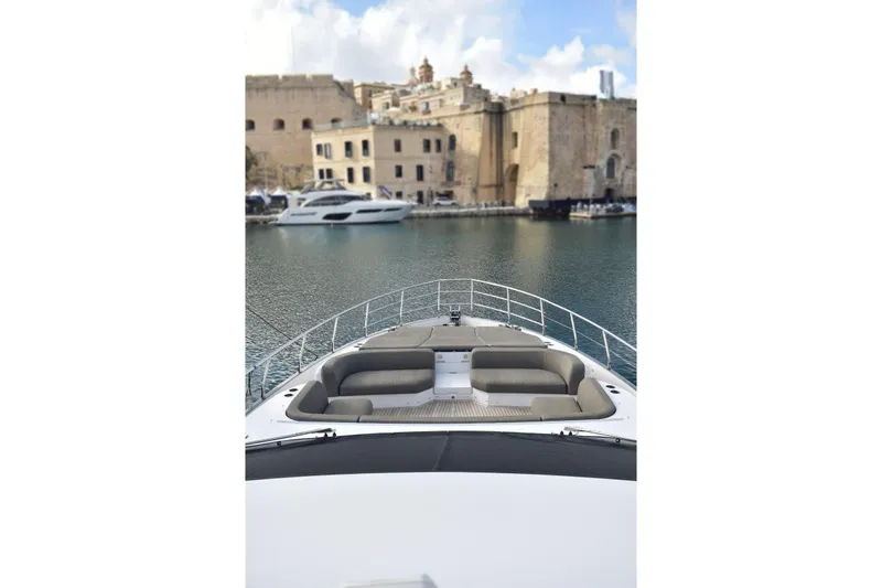  Yacht Photos Pics Azimut Fly 78 yacht, 2022 model, docked near historic waterfront buildings.
