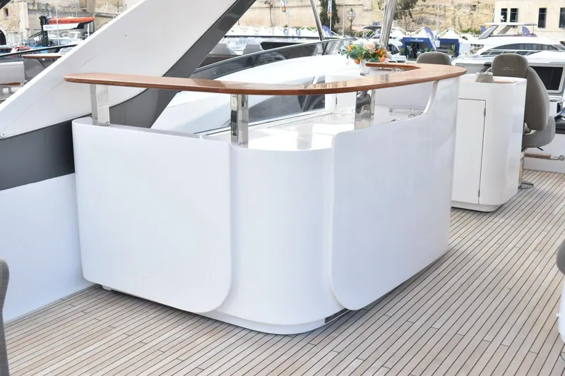  Yacht Photos Pics Luxurious 2022 Azimut Fly 78 yacht deck with sleek bar and seating area.