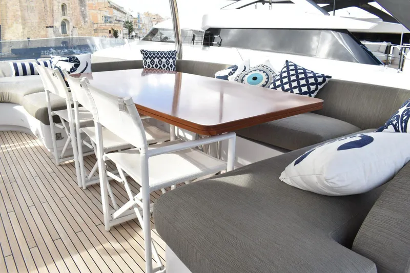  Yacht Photos Pics Luxurious 2022 Azimut Fly 78 yacht deck with elegant seating and decorative cushions.