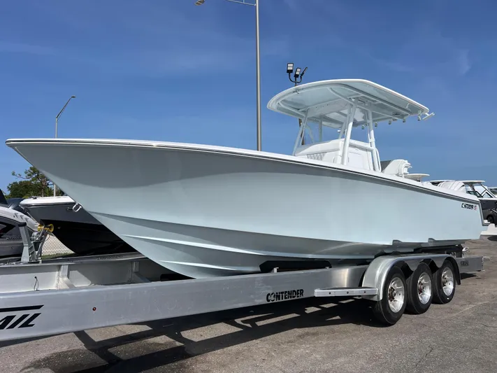  Yacht Photos Pics 2025 Contender 30 ST boat on a trailer, displayed outdoors under a clear blue sky.
