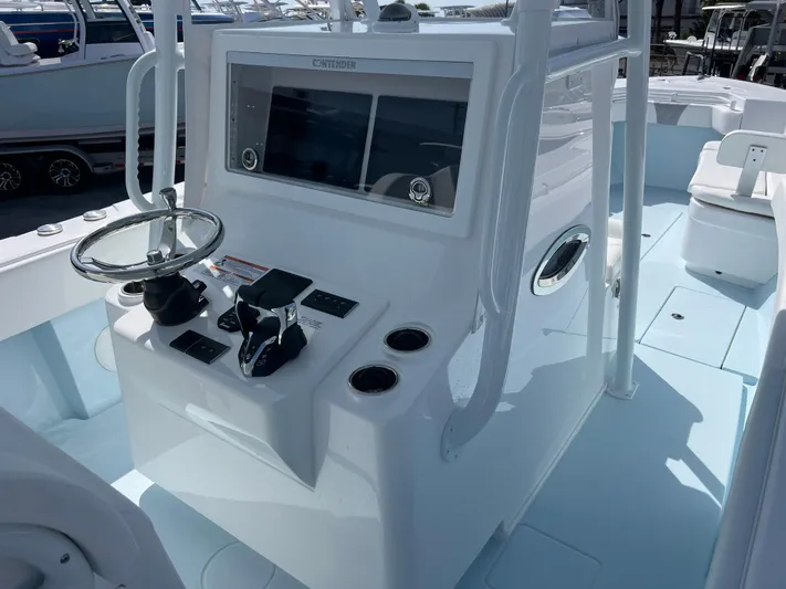  Yacht Photos Pics 2025 Contender 30 ST boat console with steering wheel and controls.